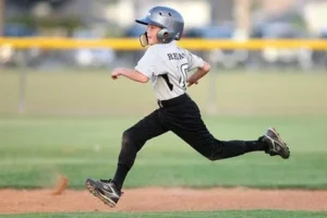 boy baseball player running