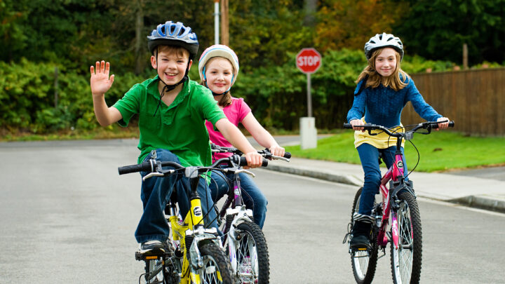 3 children biking towards camera