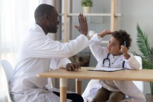 doctor and child high-fiving
