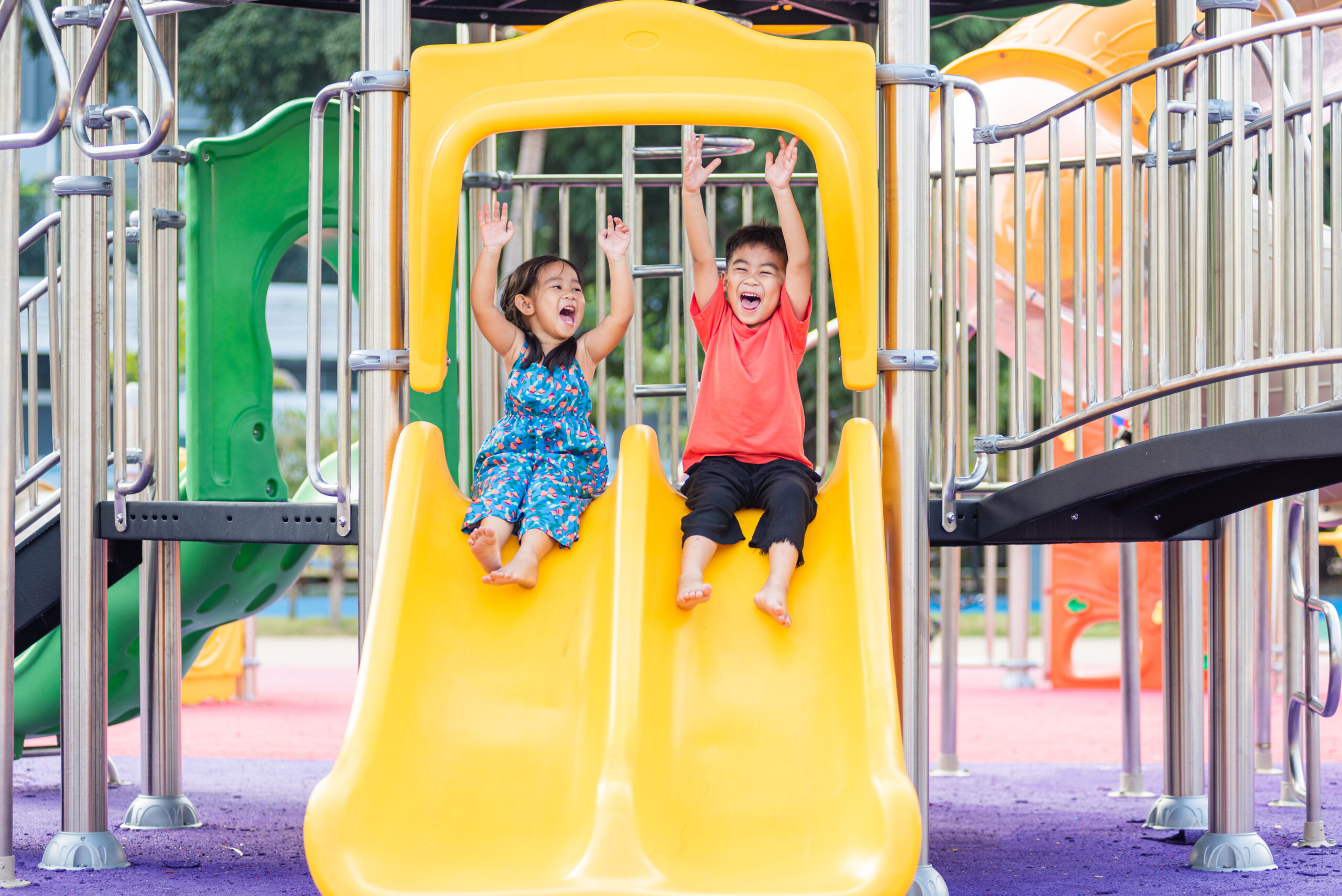 Two preschoolers on slide